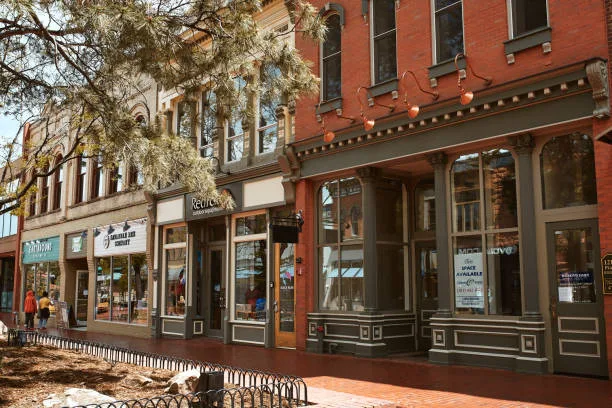 Brick storefront shops along a pedestrian shopping street