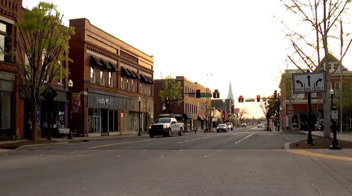 Storefronts and a church steeple on the downtown square in Gallatin, Tennessee